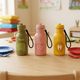 TRIXIE Trinkflasche personalisiert mit Gravur - Löwe, Dino und Schmetterling 350ml - Muckelmeister